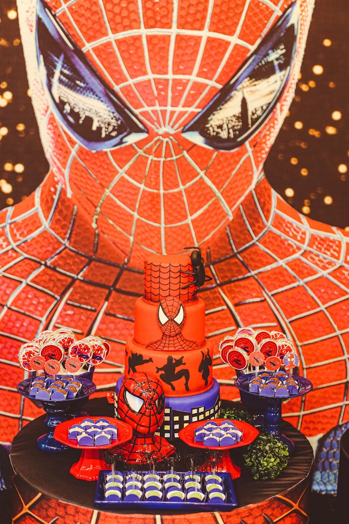 Colorful Spider-Man-themed cake and treats for a superhero birthday celebration